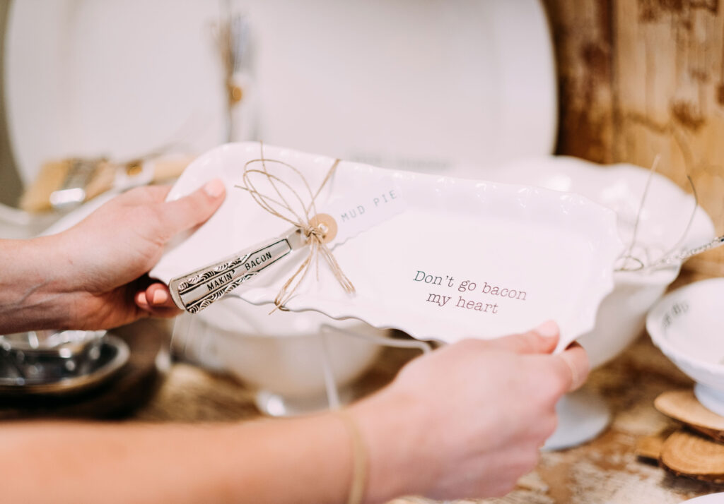 a person holding a plate with a name on it.