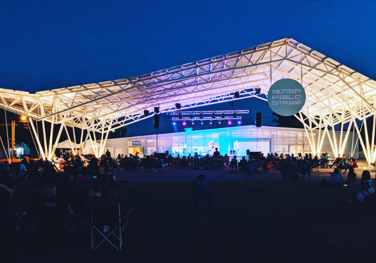 a large outdoor concert venue lit up at night.