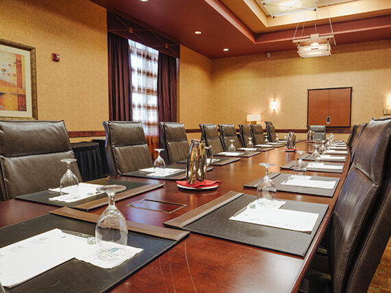 a conference room with a long table and chairs.